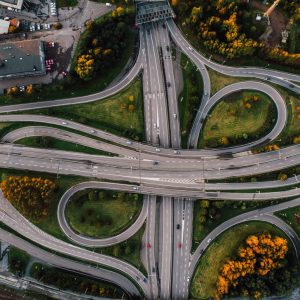 aerial-shot-twisted-roads-surrounded-by-parks-middle-city (1)